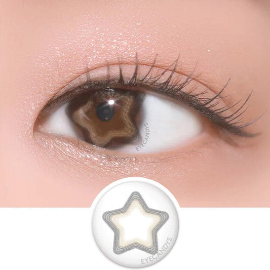 Macro shot of an eye wearing the DooNoon Nemo Star Beam Brown prescription colour contact lens, showing the multi-colored detail and natural effect on dark brown eyes, with clean eye makeup. At the bottom is the pattern of the colored lens design, showing the dotted detail and pigmentation.